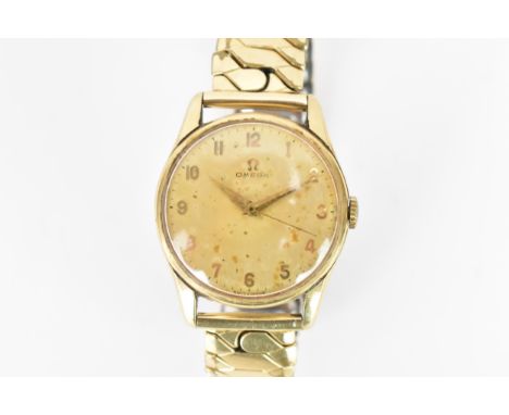 An Omega, manual wind, gents, 9ct gold wristwatch, circa 1963, the dial having Arabic numerals, on a later gold plated expand