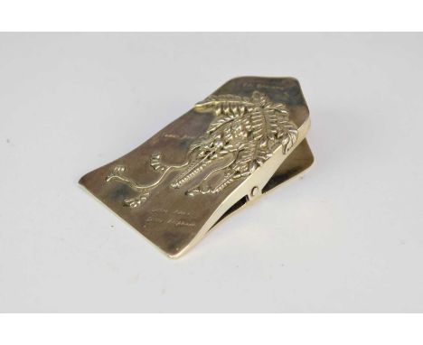 A Japanese silver paper clip, Hakone 1903Of wedge shape and embossed with wisteria flowers, inscribed 'Oki Okusama, Sunny Jea