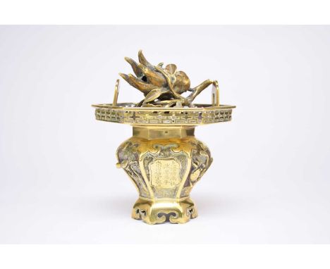 A Chinese brass censer and cover, Qing Dynasty, 19th century, of hexagonal baluster shape with wide fretwork-pierced rim and 