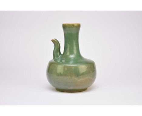 A Chinese celadon glazed stoneware ewer, possibly KangxiOf mallet form with small scroll spout, decorated with a mid green gl