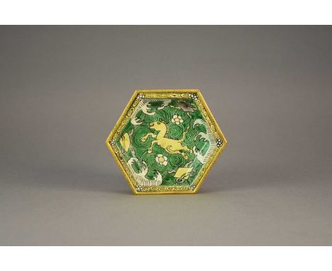 A Chinese gilt-metal mounted biscuit famille verte dish, KangxiOf hexagonal form, painted in yellow, green and aubergine with