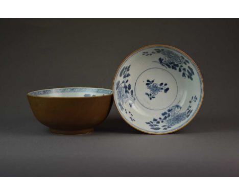 A pair of Chinese cafe-au-lait blue and white bowls from the Nanking Cargo, 1752Of rounded form, the outsides decorated with 