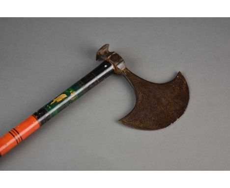 A Ceylonese ceremonial axe, 19th centuryThe iron head tooled with stylised foliage, the straight shaft painted black with gre