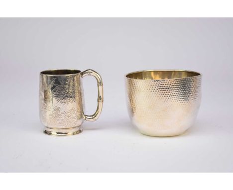 A Chinese silver mug by Woshing, circa 1850,Of plain rounded form with 'bamboo' handle, chased with chrysanthemums and rocks 