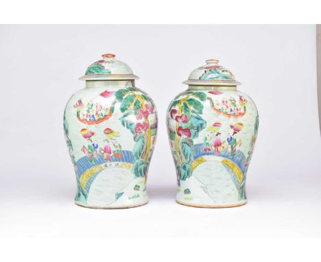 A pair of Chinese Famille Rose vases and covers, Qing Dynasty, late 19th/early 20th century, of baluster form, the domed cove