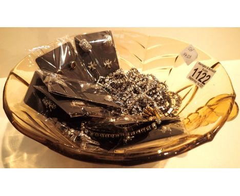 A glass bowl of costume jewellery including marcasite earrings. P&amp;P Group 1 (£14+VAT for the first lot and £1+VAT for sub