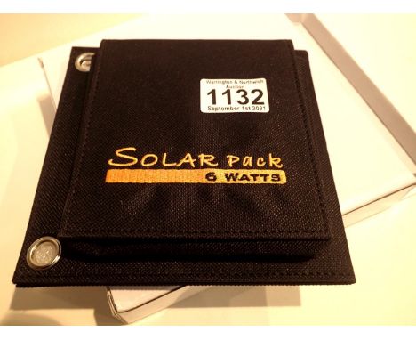 New old stock, 6 watt folding solar panel pack with one USB charging output. Integral part of case with magnetic catch and po