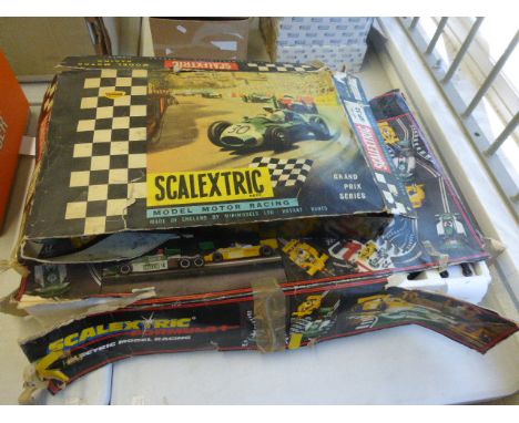 Two boxed Triang Scalextric slot car sets to include GP32 with Cooper in yellow and Lotus in green , both af and F1 set with 