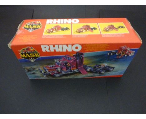 Boxed Kenner MASK Rhino Tractor rig/mobile defence unit with 2 action figures, unopened, box gd with 2.5" tear to side flap