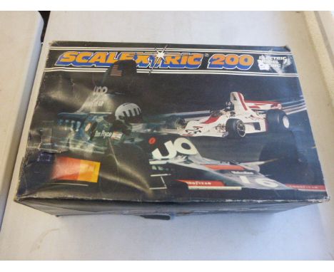 Boxed Scalextric 200 C559 complete with power unit and an additional slot car