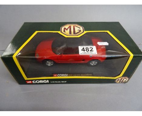 Boxed Mattel Hot Wheels Service Center plus a boxed Corgi 1:18 MG MGF 1.8i VVC Roadster