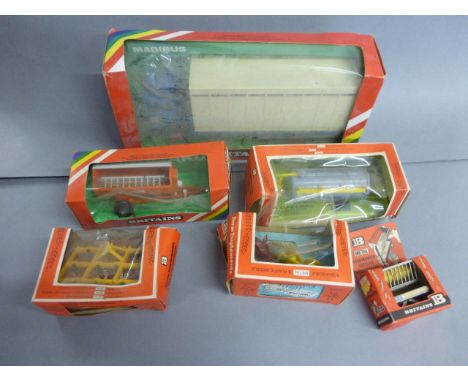 A small collection of boxed Britains models to include Animal Transporter 9580, Farm implements 9560, Farm Implements 9561, R