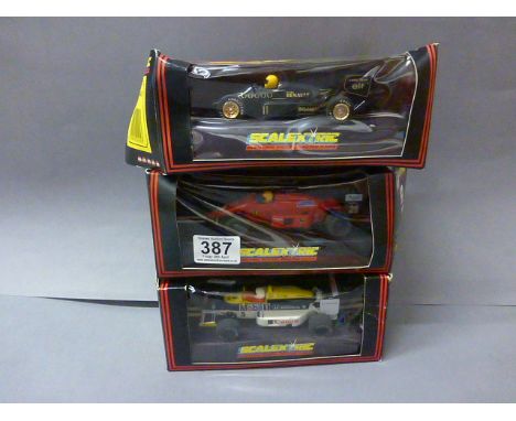 Three boxed Scalextric F1 slot cars including C457 Ferrari, C425 Lotus Renault and C426 Williams Honda FW11