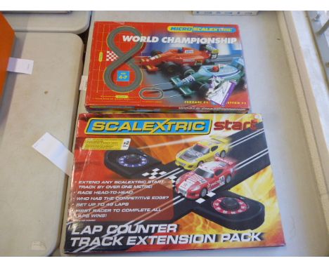 Boxed Micro Scalextric World Championship Ferrari F1 v Benetton F1 complete with both cars plus a boxed Scalextric Lap Counte