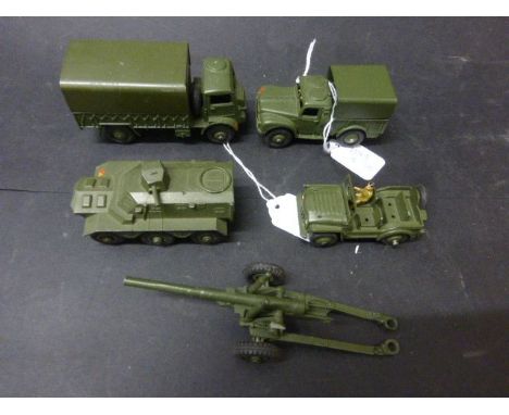 Five Dinky military diecast vehicles and artillery to include Austin Champ, Armoured Personnel Carrier, Army 1 Ton Cargo Truc