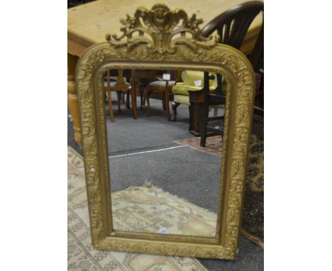 A rococo style gilt framed mirror, carved acanthus leaves and floral swags 62cm x 103cm 