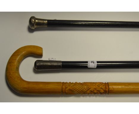 Walking Canes - a pair of silver topped, malacca shaft walking canes; a geometrically carved walking stick (3)