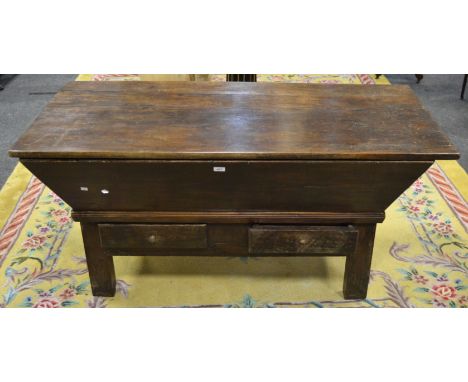 A French dough trough, planked top, outswept sides, drawers to base, turned handles, stile feet, 74cm high, 150cm wide