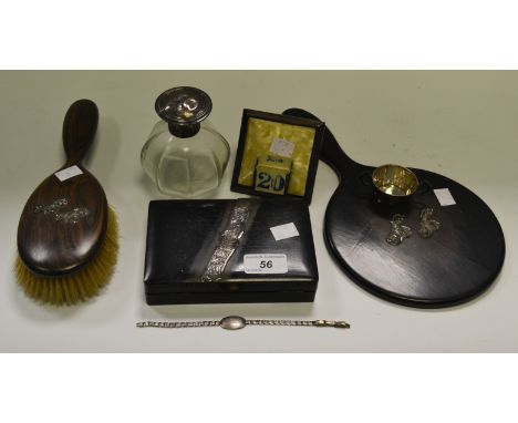 Ladies ephemera - a silver topped glass scent bottle hallmarked MBROS, Birmingham, 1912; an ebony brush, hand held mirror and