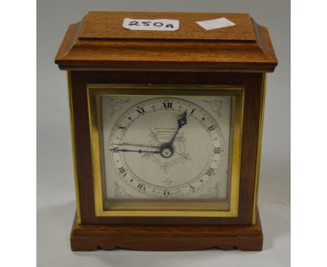 An Elliott walnut mantel clock, retailed by A.Bright and Sons Scarborough