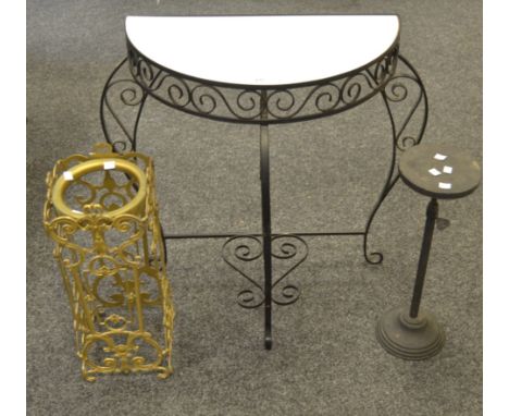 A gilt metal stick stand; an adjustable torchere; a wrought iron demi-lune hall table (3)