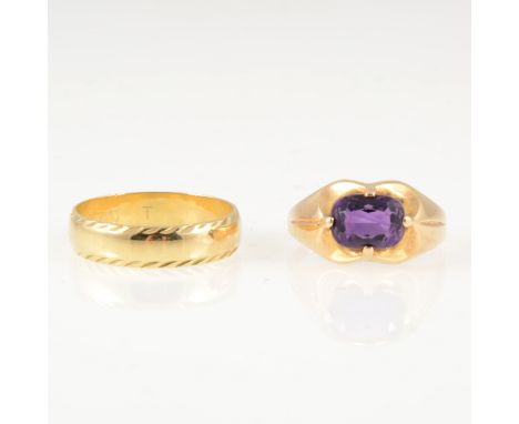 Two gold rings, an oval mixed cut amethyst four claw set into a yellow metal dress ring mount, shank marked 585, gross weight