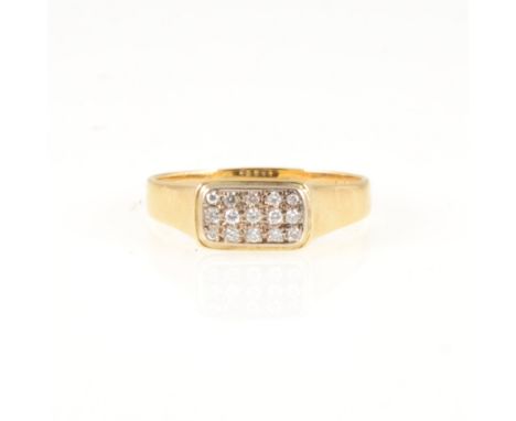 A modern diamond cluster ring, fifteen small diamonds pave set in three rows as a rectangular cluster in an 18 carat yellow g