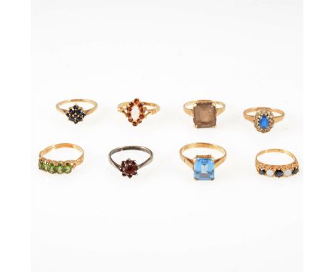 Eight gemset dress rings, garnet, sapphire, opal, smoky quartz, synthetic blue and white stones, CZ, one silver set, the rest