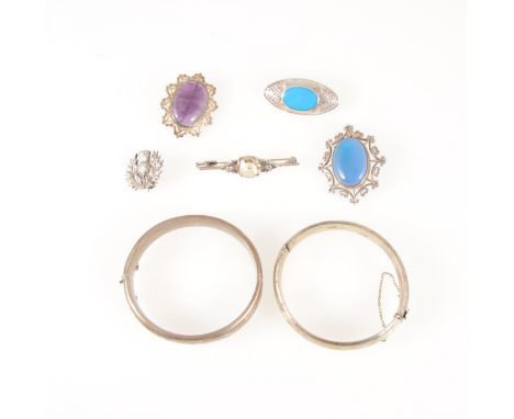 Two silver hollow half hinged bangles,12.5mm and 13mm wide, scroll engraved decoration to front, five silver brooches to incl