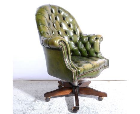 Modern buttoned green leather swivel desk chair, width 80cm.