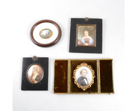 Three 19th Century portrait miniatures on ivory panels, including one of a gent in gilt metal frame and folding leather case,