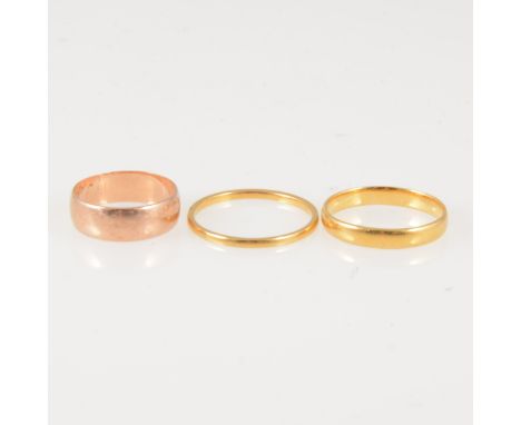 Three plain gold wedding rings, two 22 carat yellow gold wedding rings, 1.4mm wide, approximate weight 1.9gms, ring size Q, 3