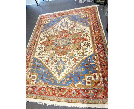 Indian caucasian pattern carpet, central medallion on a patterned ivory coloured field, sky blue spandrels, border within gua