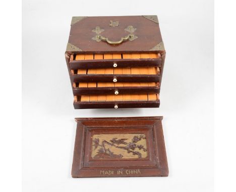 A Mahjong set in wooden case, by Chad Valley, 6th edition, with bamboo and bone tiles, stained wood and metal mounts.