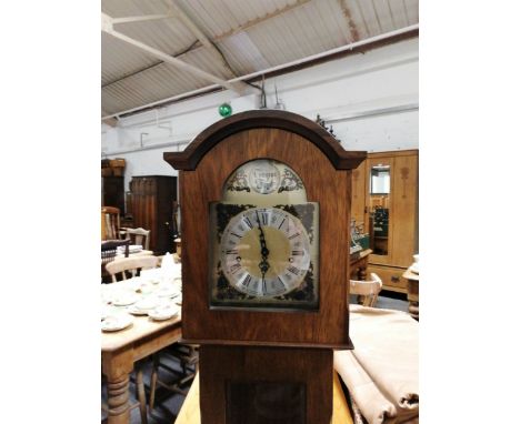 A modern German grandmother clock, wooden case, arched dial with silvered chapter ring, key-wind pendulum movement, glazed pa