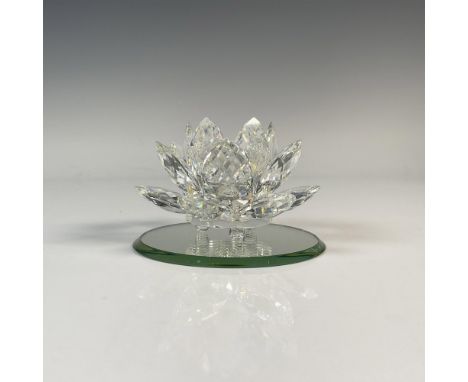 Beautiful crystal petals on round footed base. Accompanied by a circular mirror base. Swarovski backstamp. This item has its 