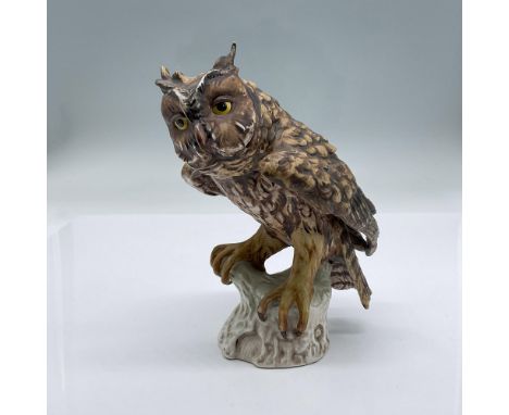 This item is a beautifully detailed multicolor animal themed design. A stunning perched yellow eyed Screeching Owl with its t