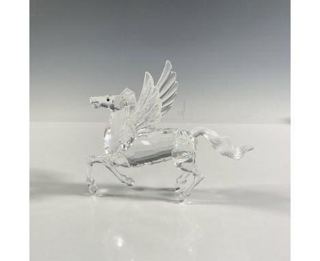 A clear figural of a majestic winged horse with a frosted tail and topaz colored eyes. 1998 Swarovski Crystal Society edition