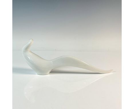 White glazed porcelain abstract figure of a swan. Royal Dux Bohemia stamp. Dimensions: 12.5"L x 2"W x 4.5"HManufacturer: Roya