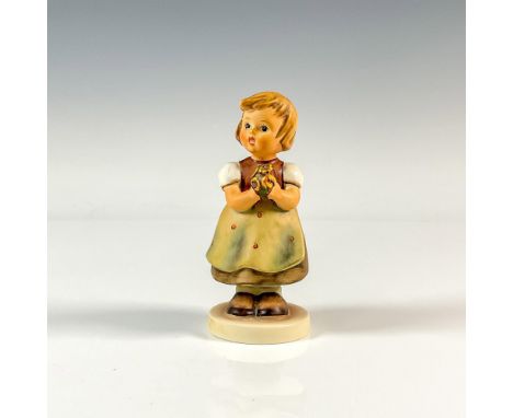 A matte and glossy figural of a sweet girl holding a bouquet of yellow flowers. M.I. Hummel impressed. Goebel backstamp. Issu