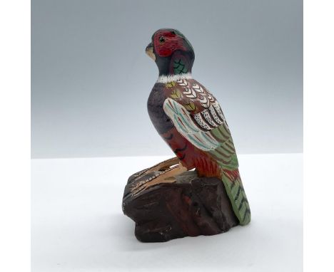 A heavy hand painted bird with colorful details. The body is painted in various shades, including browns, greens, and whites.