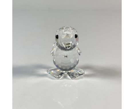 A duckling quacking away. It has a clear cut crystal body with black eyes. This item has its original box which measures 2.75