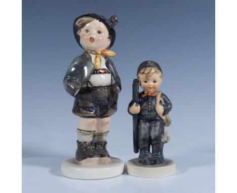 Glossy and matte finish. Features two little boys dressed in dark brown and grey clothes. Tallest piece dimensions: 5.75''H x