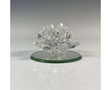 Beautiful crystal petals on round footed base. Accompanied by a circular mirror base. Swarovski backstamp. This item has its 