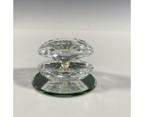 A clear faceted clam shell with a pearl in the middle and a round small mirrored base. Swarovski marking on shell. Shell: 2.5