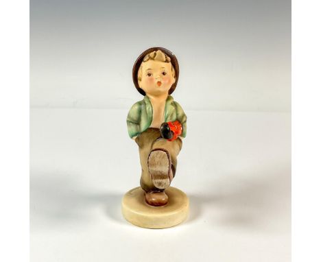 Hand painted in matte finish. Depicts a little boy walking with umbrella and bag. Goebel backstamp. Artist: M.I HummelIssued: