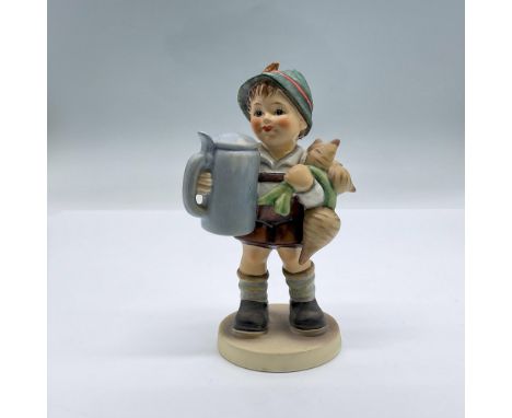 This is a beautifully hand painted porcelain figurine of a young boy with Turnips, holding a Beer Stein. Backstamped by 87, 1