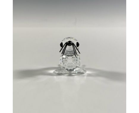 A clear faceted figure of a seal with black eyes and a metal nose and whiskers. Swarovski marking. This item has its original