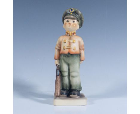 Hand painted porcelain figurine depicting a young man in soldier kit. Goebel backstamp. Artist: M.I HummelIssued: 21st centur