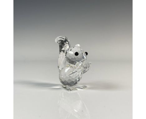 Squirrel feeding on a nut with a clear cut crystal body with black eyes. This item has its original box which measures 2.5"H 